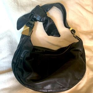 Badgley Mischka black leather bow tie handle hobo purse with gold detailing